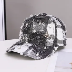 Tweed fringed baseball cap with rhinestones and metal star for women, chic black and white.