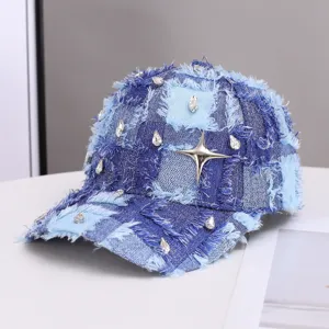 Distressed denim baseball cap featuring sparkling rhinestones and a metal star charm.