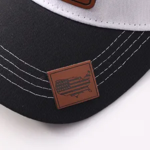 Detalle gorra de béisbol trucker negro blanco contraste con bandera americana cuero