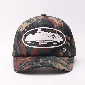 Detailed view of the stylish camo trucker hat featuring a unique cruise logo patch.