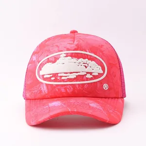Pink camouflage trucker mesh cap with white patch, stylish outdoor sunshade baseball hat.