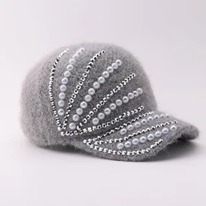 Grey furry baseball cap with sparkling rhinestones and pearl embellishments for women.