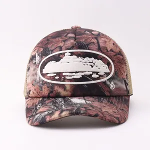 Stylish camouflage trucker hat with cruise ship patch, breathable mesh back, summer cap.