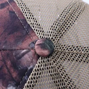 Close-up detail of camouflage trucker hat top, breathable mesh, stylish summer sun hat.