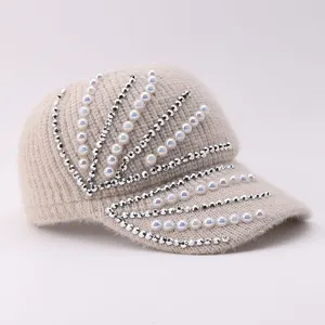 Beige knitted baseball cap featuring sparkling rhinestones and elegant pearls for winter style.