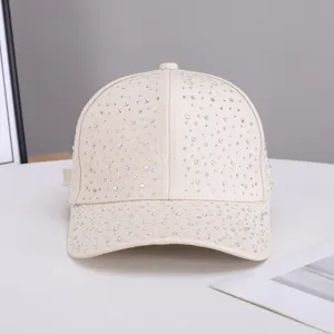 Details of beige rhinestone baseball cap, sparkling crystal studded curved brim hat for women.