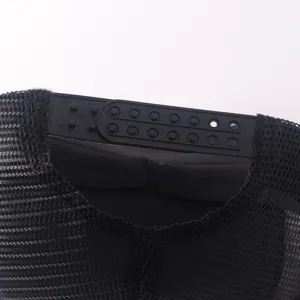Black mesh trucker cap adjustable plastic snapback closure detail close-up view