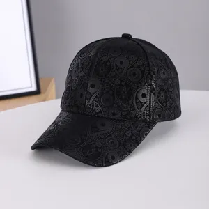 Black suede baseball cap with silver paisley print, curved brim, stylish streetwear hat.
