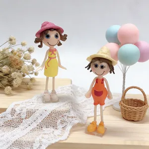 Detailed view of two cute creative girl doll fridge magnets with colorful decorative props