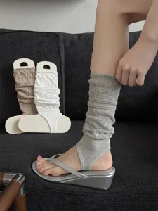 Detailed view of hollow knit stirrup socks for women, breathable summer leg warmers.