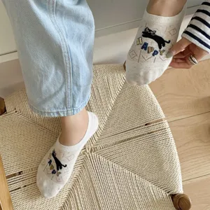 Detail view of breathable mesh low-cut women socks with cute cat embroidery and letters.
