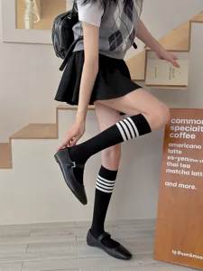 Japanese style black knee high socks with white stripes stylish JK leg wear for women.