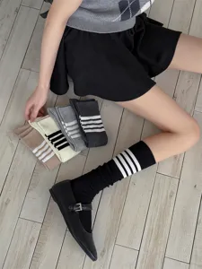 Japanese style striped knee high socks for women, soft and comfortable cotton hosiery.