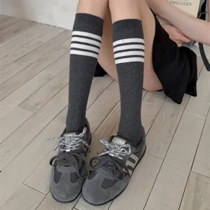 Grey knee high socks for women feature classic three white stripes, soft Japanese JK style knit.