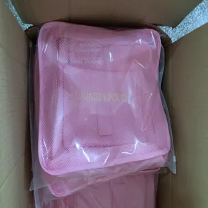 Pink travel laundry pouch set mesh storage bags for luggage organizer packing cubes.