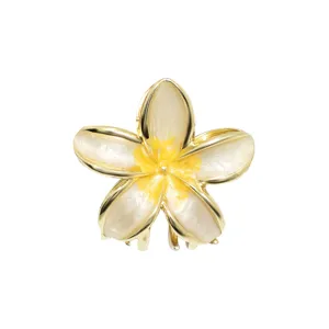 Detailed view of the yellow plumeria flower hair claw clip with gold-toned metal edge
