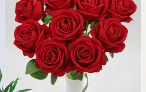Detailed close-up of vibrant red velvet artificial rose petals with realistic texture