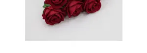 Close-up detail of deep red artificial velvet roses for home and wedding decoration