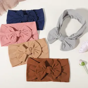 Kollektion von fünf weichen, elastischen Nylon-Baby-Stirnbändern mit großen Schleifen