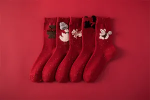 Red wool blend speckle yarn mid-calf socks with cute knit animal and bow details for winter.