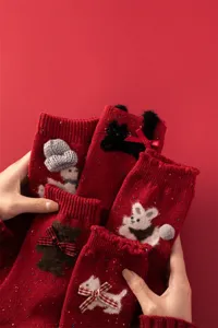 Red wool knit socks for women featuring cute animal decorations and bows, warm winter mid-calf socks.