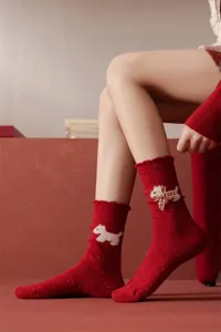 Red wool speckle yarn mid-tube socks for women featuring a cute white dog and plaid bow design.