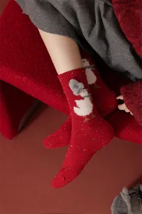 Cozy red wool winter socks featuring a cute duck design with a knit hat, warm and festive style.