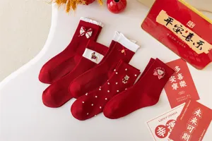 Red mid-tube socks for Chinese New Year festive wear, cute bow and bear embroidery.