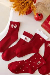 Red mid-tube socks for Chinese New Year, cute bow and bear embroidery design for women.