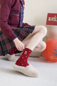 Red mid-tube socks for Chinese New Year, cute bear embroidery and white polka dots, soft cotton.