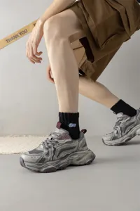 Men's mid-tube cotton socks with stylish embroidery, breathable street style sports socks for daily wear.