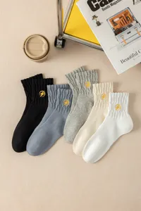 Men's cotton mid-tube sports socks with yellow lightning embroidery in five colors.