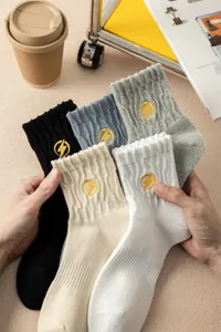 Men's cotton mid-tube socks featuring stylish yellow lightning embroidery. Multi-color 5-pack.
