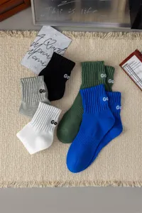 Men combed cotton mid-tube socks with heel embroidery letters trendy sports basketball socks.