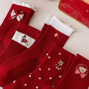 Red festive mid-tube socks for women, featuring cute bowknot, embroidery bear and polka dot.