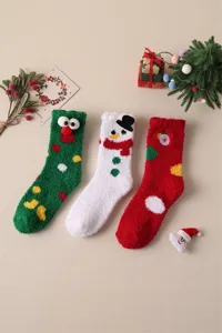 Warm Christmas fuzzy socks for women, thick winter thermal mid-tube socks with cute cartoon designs.