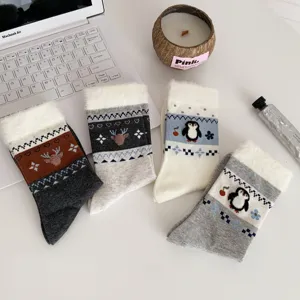 Fuzzy winter socks with cute deer and penguin patterns, soft thermal mid-tube socks for women.
