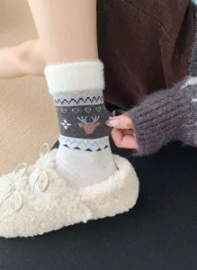 Cozy winter women socks feature cute reindeer Fair Isle pattern and soft plush fluffy cuff detail.