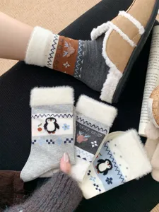 Cozy winter fuzzy socks detail featuring cute penguin and deer fair isle patterns with plush cuff.