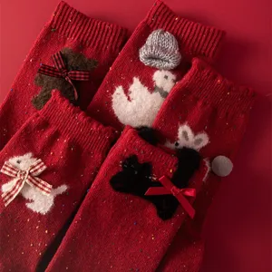 Red wool mid tube socks for women featuring cute 3D bows and animal designs for new year.