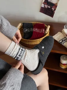 Cozy wool winter socks featuring traditional Nordic snowflake patterns for cozy warmth.