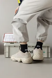 Men's stylish mid-calf cotton socks with cool embroidered letters for daily wear.
