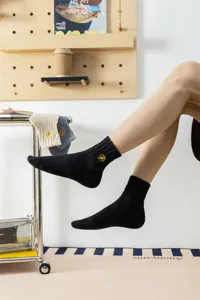 Comfortable men's mid-tube cotton socks featuring a stylish yellow lightning embroidery design.