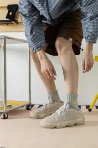 Men's cotton mid-tube socks featuring yellow lightning embroidery, breathable athletic design.