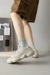 Men's cotton mid-tube socks with stylish letter embroidery, breathable and comfortable.