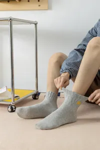Men's cotton mid-tube socks with stylish embroidered lightning pattern for comfortable daily wear.