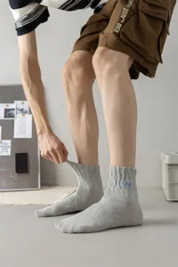 Men's gray ribbed mid-calf cotton socks with blue embroidery, casual streetwear style.