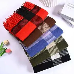 Detailed view of colorful plaid fringe scarves, classic checkered design with soft texture.