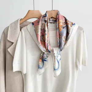 Luxury silk square scarf with classic carriage print, elegant neckerchief accessory for women.