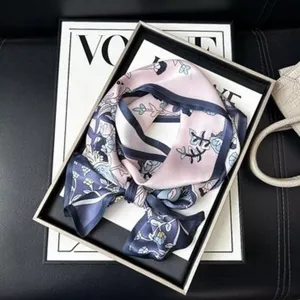 Exquisite mulberry silk small square scarf featuring elegant floral print, luxurious smooth texture.